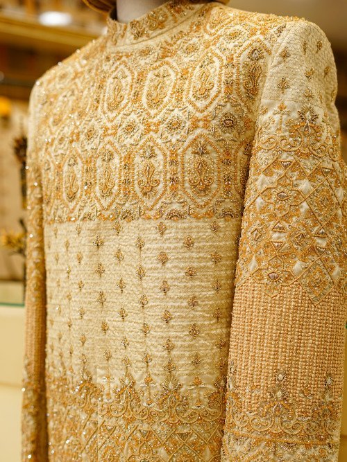 Exquisite Cream White Sherwani Featuring Full Detailed Hand Embroidery with Perfectly Coordinated Matching Kulla for a Regal and Timeless Look