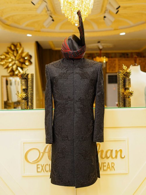Short Sherwani in Deep Black Tone with Intricate Hand Embroidery and Coordinated Matching Kulla for a Bold and Elegant Statement Description: