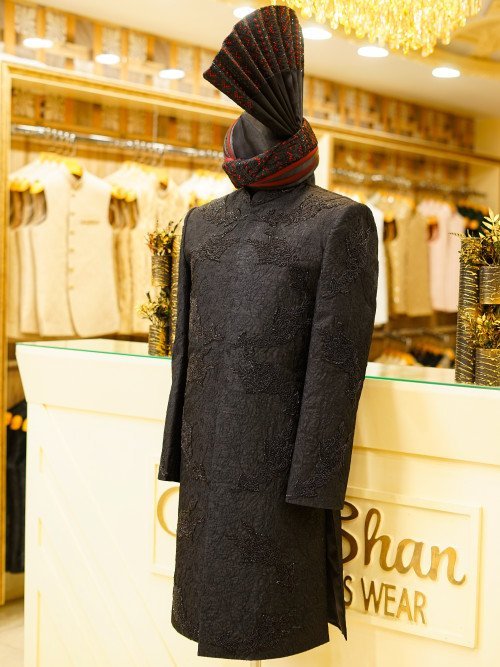 Short Sherwani in Deep Black Tone with Intricate Hand Embroidery and Coordinated Matching Kulla for a Bold and Elegant Statement Description: