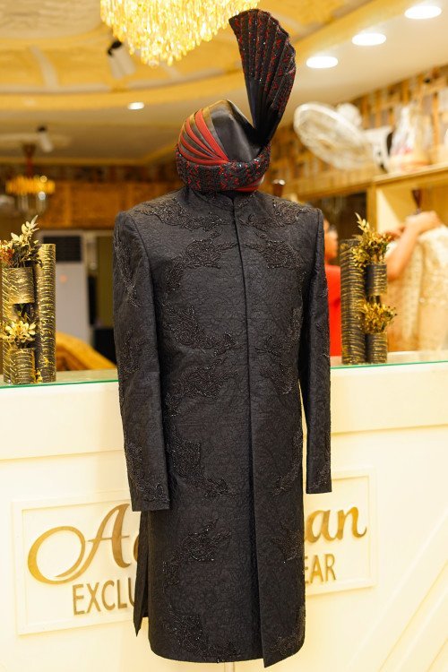 Short Sherwani in Deep Black Tone with Intricate Hand Embroidery and Coordinated Matching Kulla for a Bold and Elegant Statement Description: