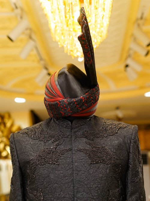 Short Sherwani in Deep Black Tone with Intricate Hand Embroidery and Coordinated Matching Kulla for a Bold and Elegant Statement Description: