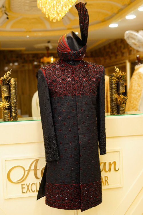 Short Sherwani in Bold Black Tone with Striking Red Hand Embroidery and Matching Kulla for a Regal Statement
