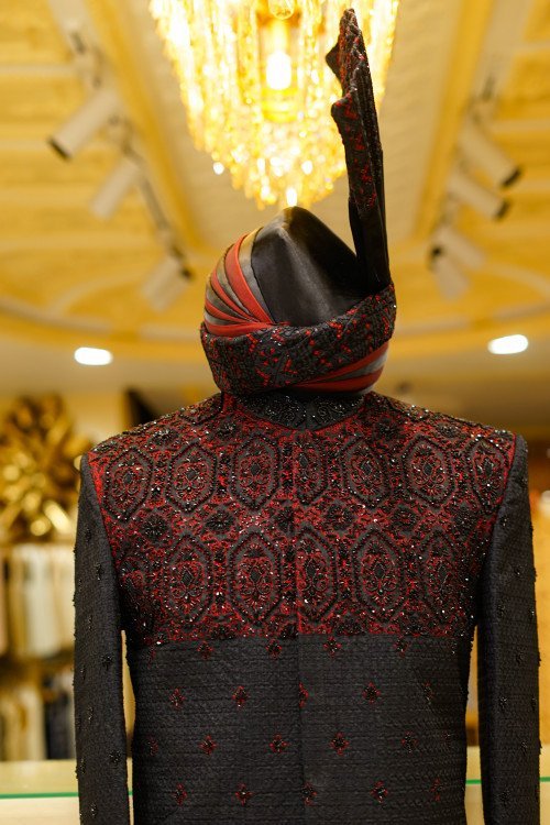 Short Sherwani in Bold Black Tone with Striking Red Hand Embroidery and Matching Kulla for a Regal Statement