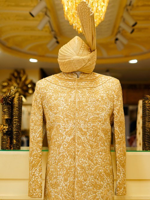 Short Sherwani in Subtle Skin Tone with Delicate Embroidery and Matching Kulla for a Graceful Heritage Look