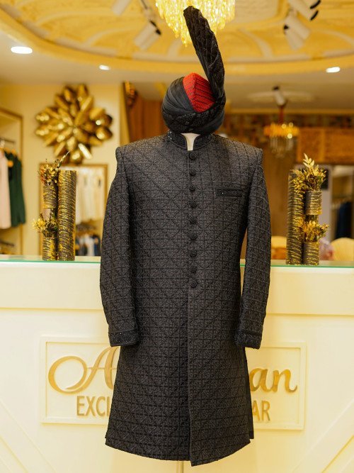 Elevate your style with this luxurious black sherwani, featuring detailed hand embroidery that reflects With Kulla