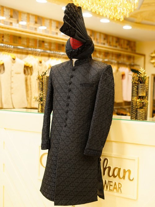 Elevate your style with this luxurious black sherwani, featuring detailed hand embroidery that reflects With Kulla