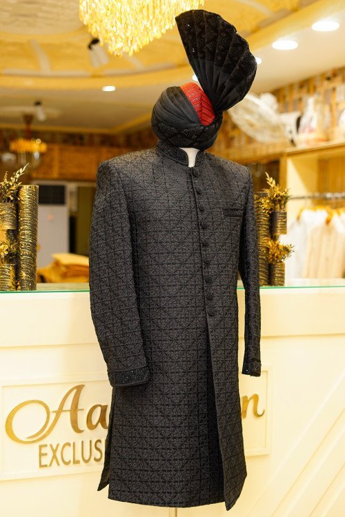 Elevate your style with this luxurious black sherwani, featuring detailed hand embroidery that reflects With Kulla