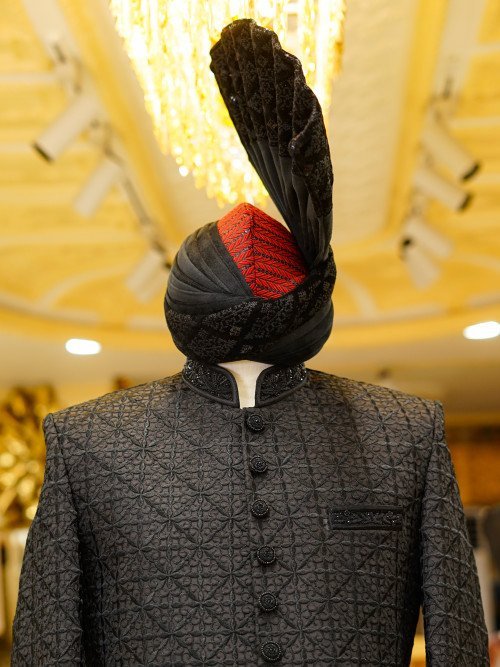 Elevate your style with this luxurious black sherwani, featuring detailed hand embroidery that reflects With Kulla