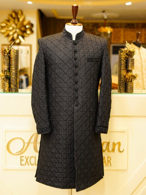 Elevate your style with this luxurious black sherwani, featuring detailed hand embroidery that reflects With Kulla